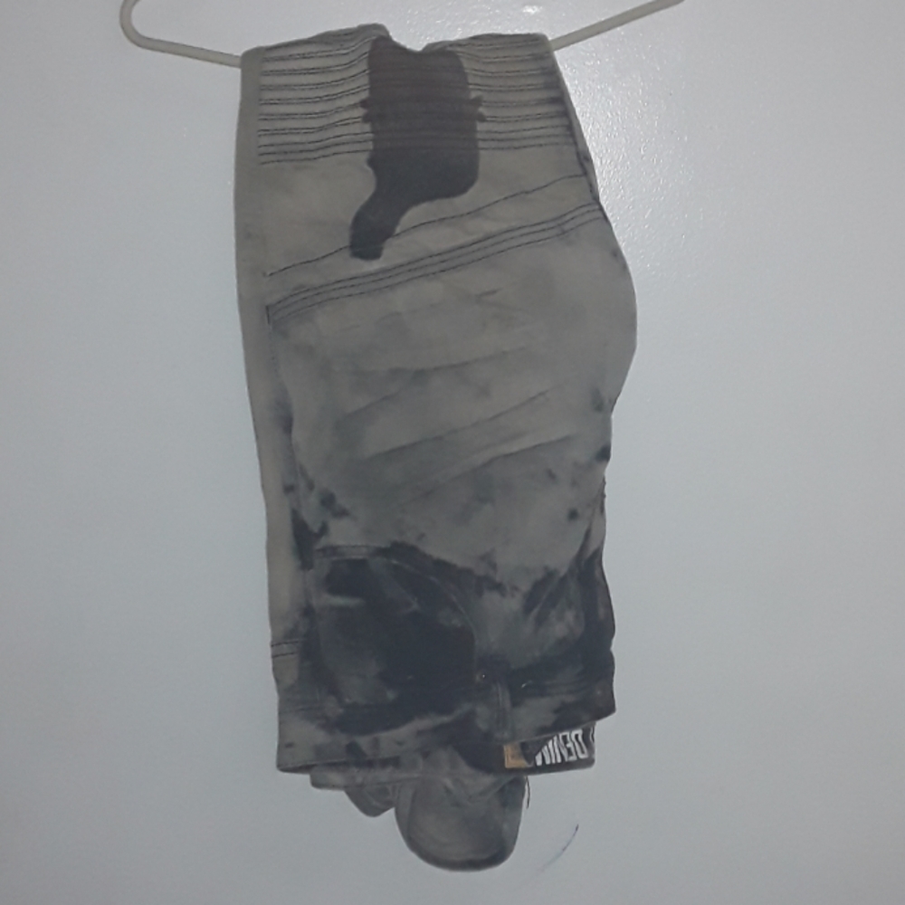 Tan and black Jean's w/ a  design created by me.